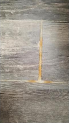 vinyl flooring crusty stuff coming up between basement floor planks home improvement stack exchange